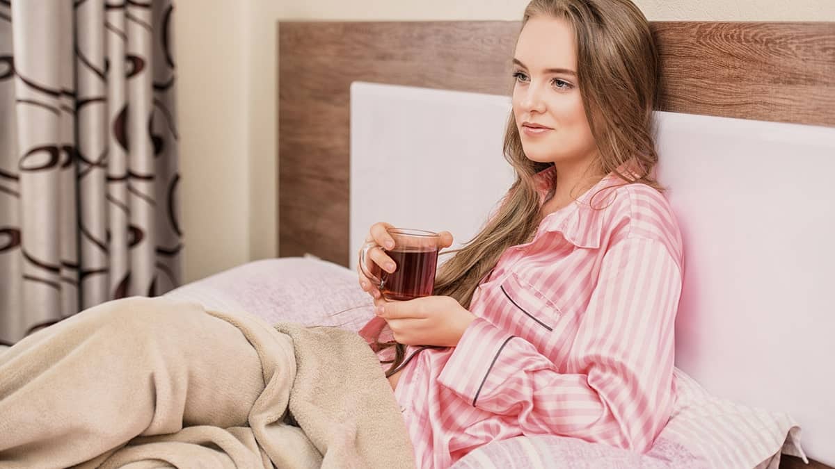 Woman wearing pajamas in bed