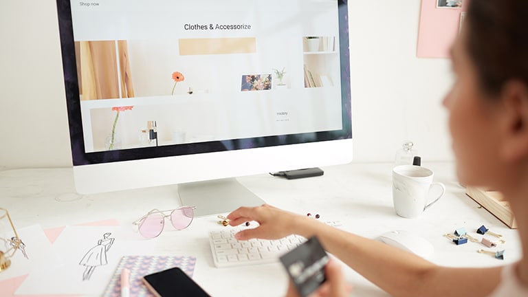 Laptop opened to online clothing store to represent shopping Overstock.com