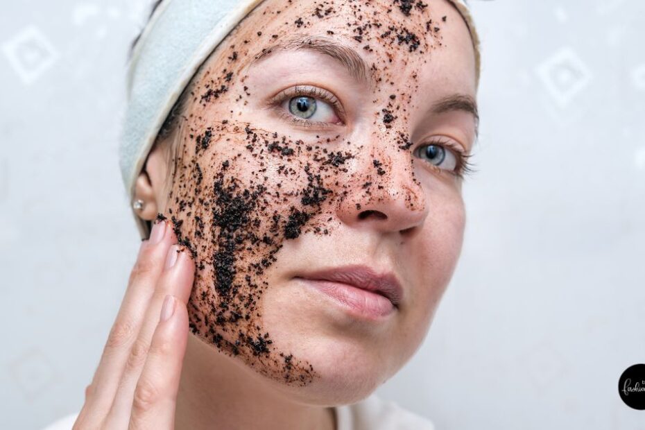 Woman applying scrub on her face.