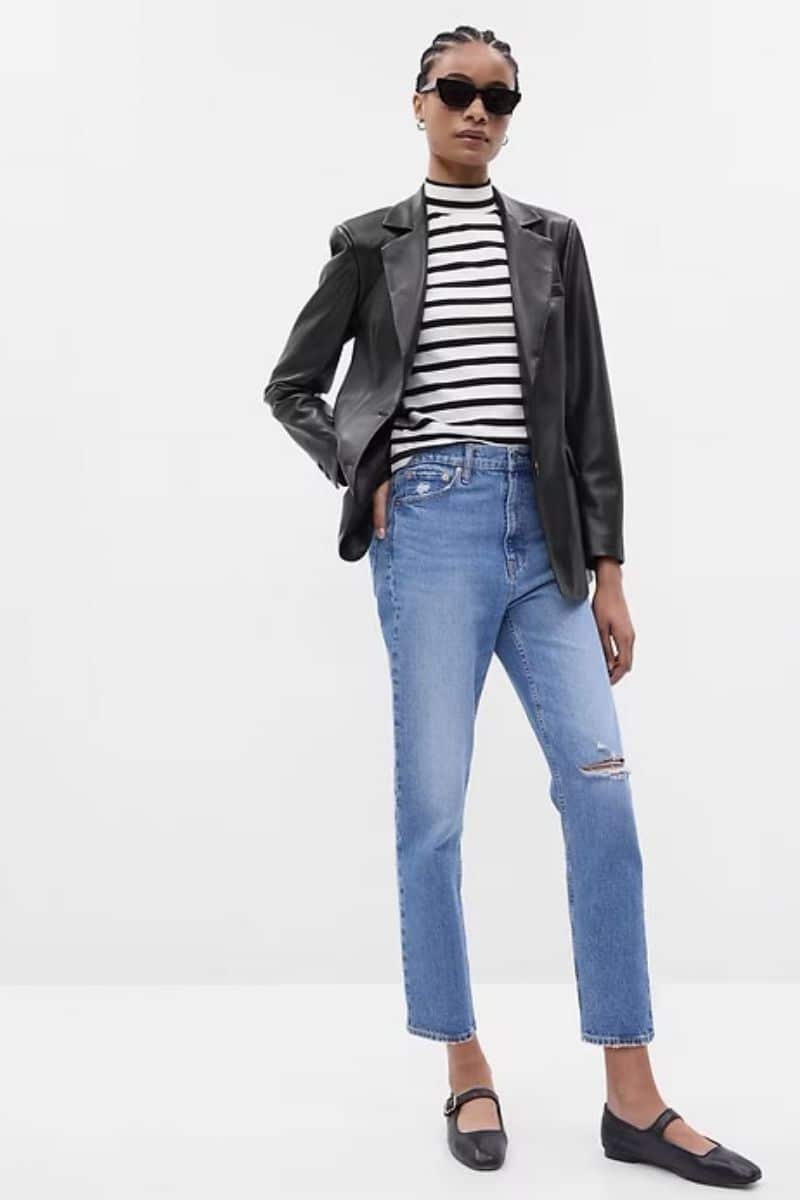 Leather Clothes are Trending: Here's How to Wear Them 5 Model wears gap leather blazer over jeans and striped top.