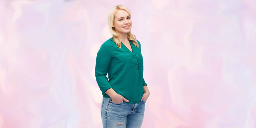 Managing wardrobe through weight changes -- pretty woman wearing jeans and green top