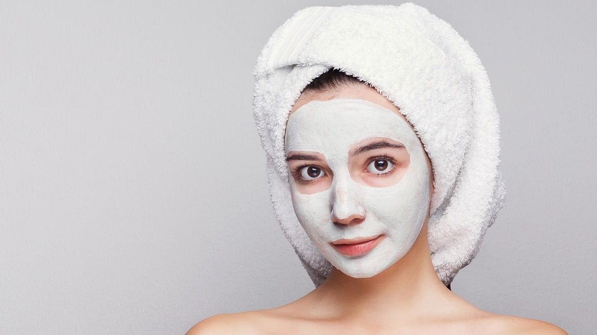 Woman giving herself DIY facial
