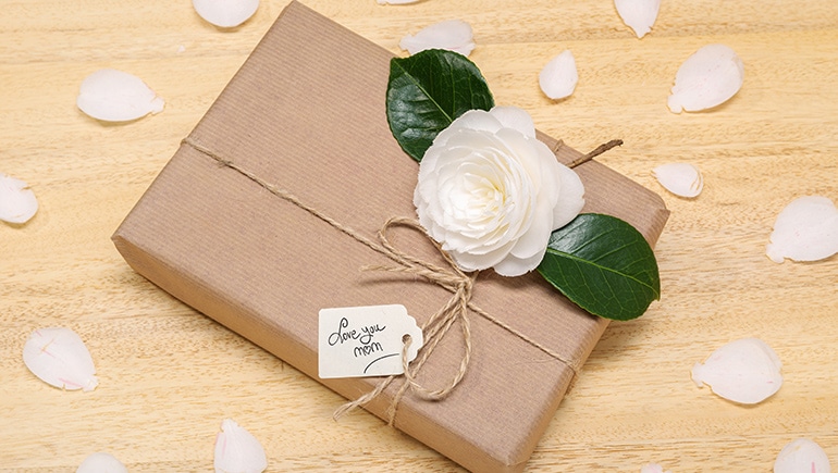 Boxed gift with card reading "love you mom."