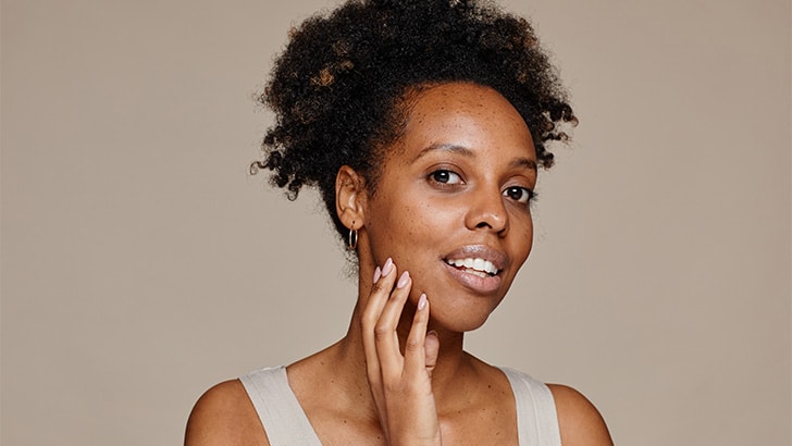 Close up of woman with natural skin tone.