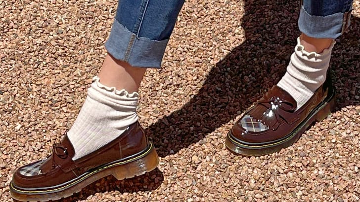 How to Wear Chunky Loafers After 40 93 Close up view of chunky loafers with socks and ankle jeans.