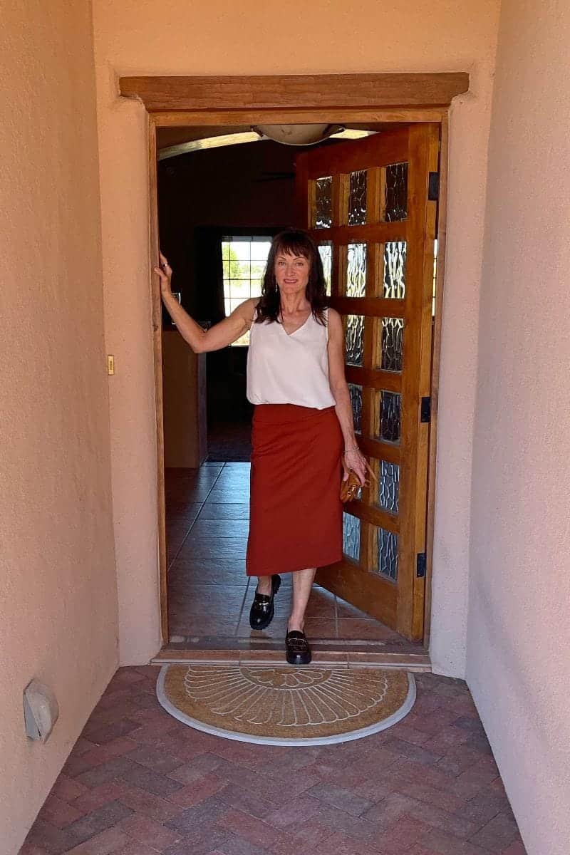 How to Wear Chunky Loafers After 40 7 Catherine Brock wearing midi skirt, loose tank top, and chunky loafers.