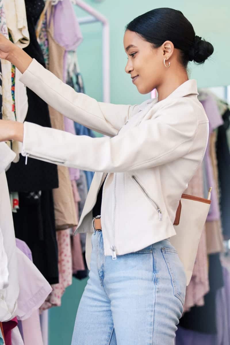 How to Earn and Save with Macy's Star Rewards 1 Loyal shopper shops in department store to represent Macy's Star Rewards.