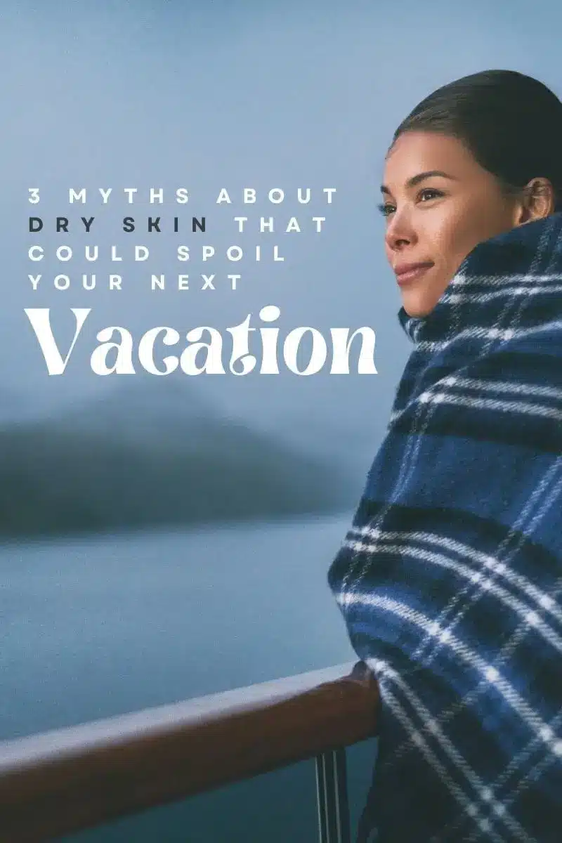 Woman standing on cruise ship deck wrapped in blanket to represent dry skin and travel.