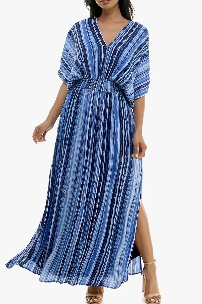 Spring 2024 Fashion Trends: 36 Trendy, Affordable Pieces to Wear Now 2 Model wears dolman sleeve dress with blue pattern against white background.
