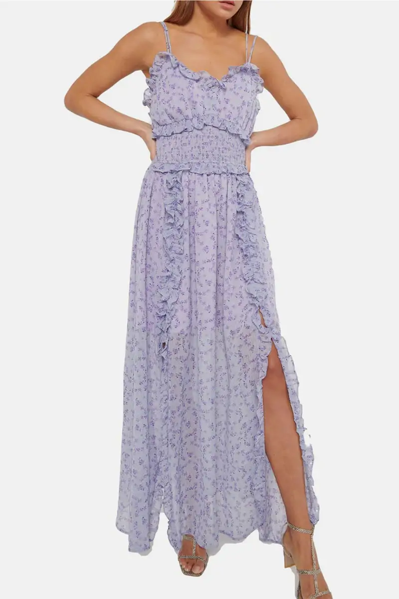 Spring 2024 Fashion Trends: 36 Trendy, Affordable Pieces to Wear Now 5 Model wears purple dress with ruffles.