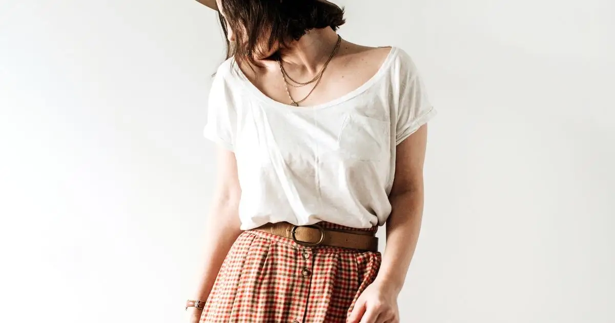 Spring 2024 Fashion Trends: 36 Trendy, Affordable Pieces to Wear Now 46 Model wears pleated pants and white top in front of white background.