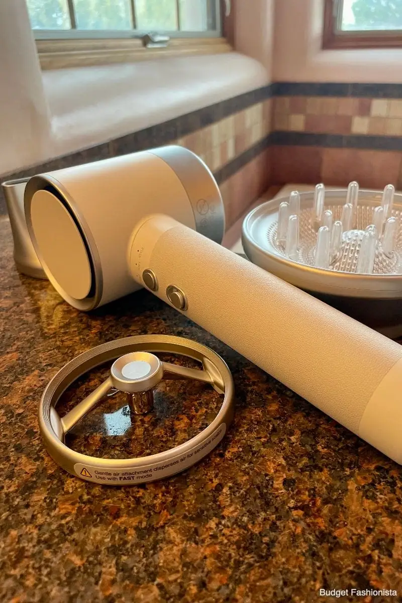 Zuvi Halo Hair Dryer: Read This Before You Buy 4 Zuvi Halo hair dryer with attachments on bathroom counter.