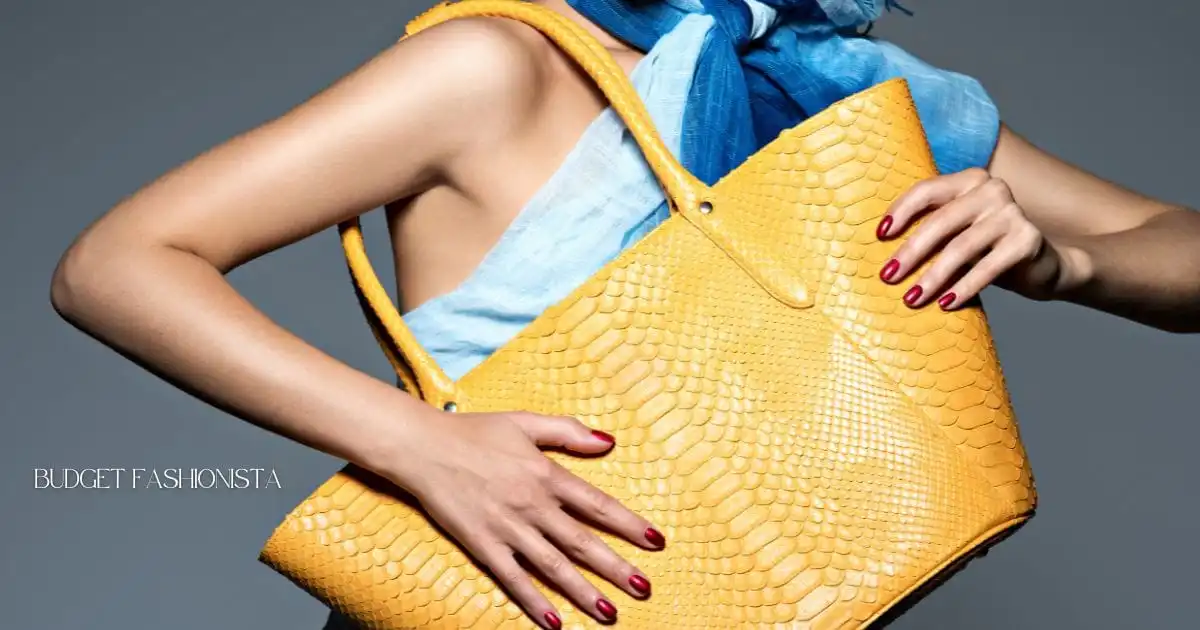 8 Signature Accessory Ideas for the 40+ Fashionista  32 Close up view of giant yellow bag held by fashionable woman.