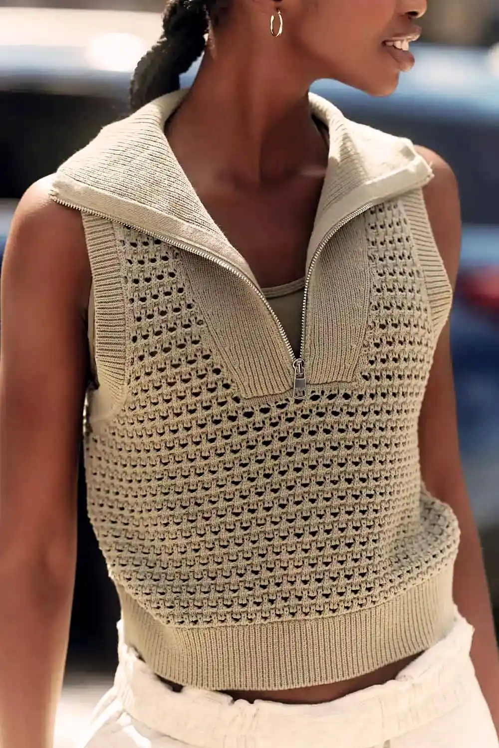 6 Fall Knits Inspired by Gigi Hadid's Instagram 2 Close up of model wearing beige sleeveless sweater.