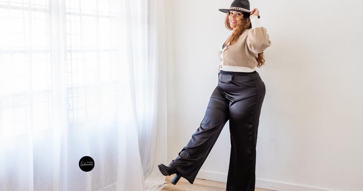 How to Style Plus-Size Wide-Leg Pants 19 Woman in hat, sweater, and black wide-leg pants.