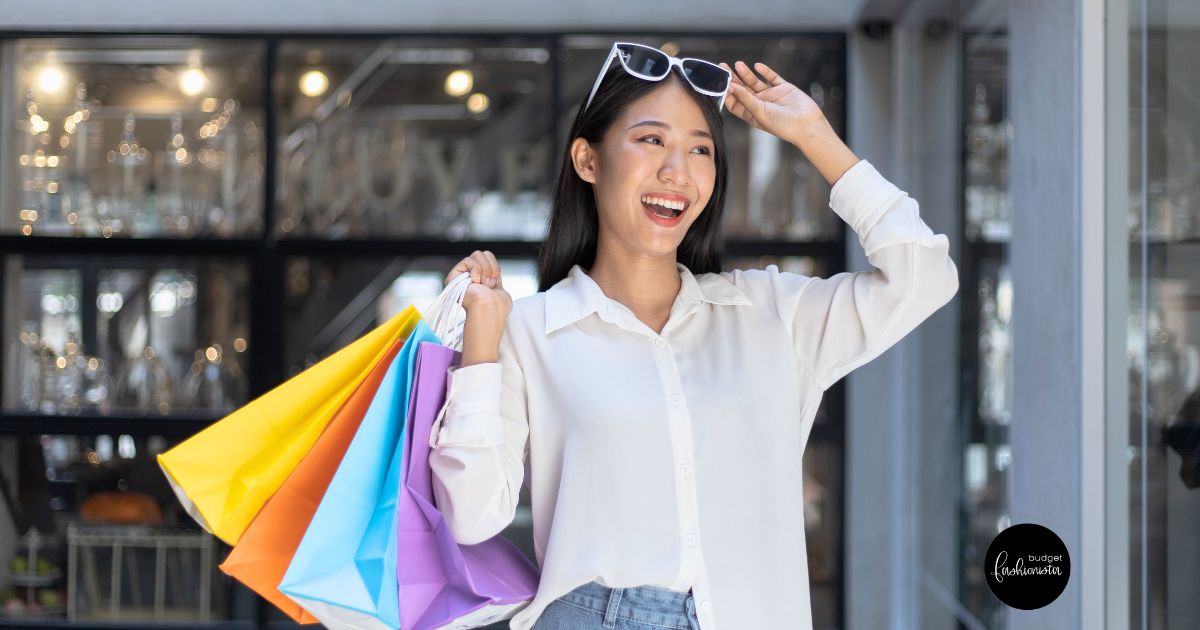 10 Best Shopping Cities and What Clothes Costs in Each 17 Happy woman holding colorful shopping bags.