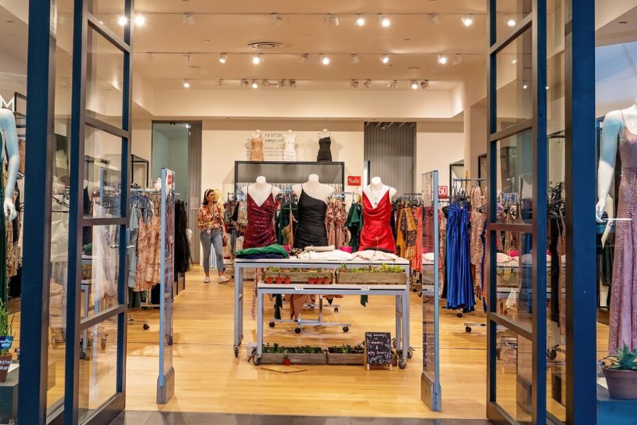 Fashion boutique with dresses and stylish displays.