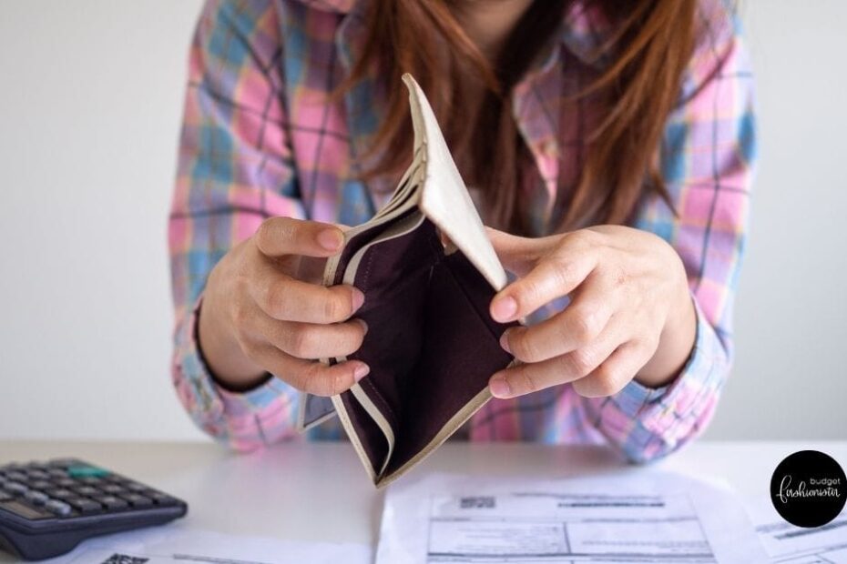 Why Am I Broke? An Expert Answers 7 Female opens wallet to show it is empty.