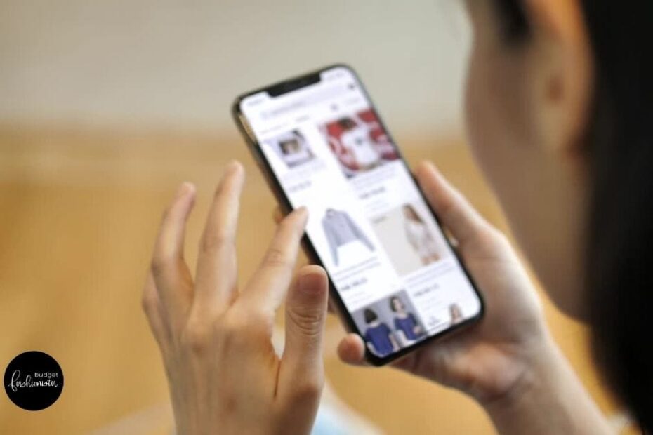 These Are the 10 Most Popular Clothing Brands 6 Close up of woman shopping popular clothing brands on smartphone.